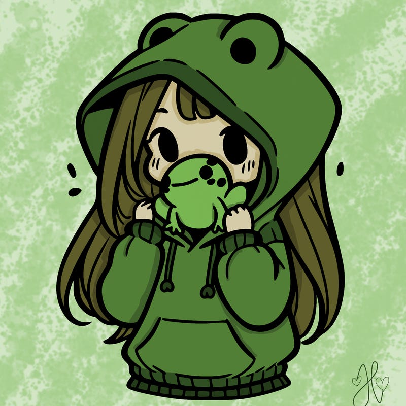 a girl holding a froggy hoodie
