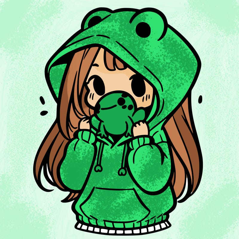 a girl holding a froggy hoodie