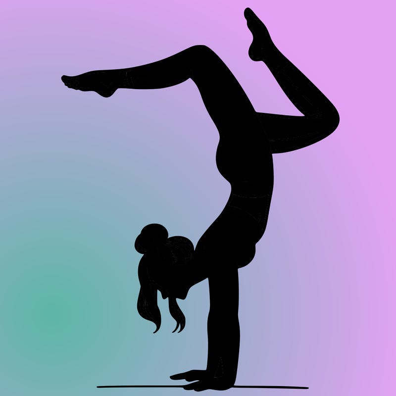 a woman doing a handstand