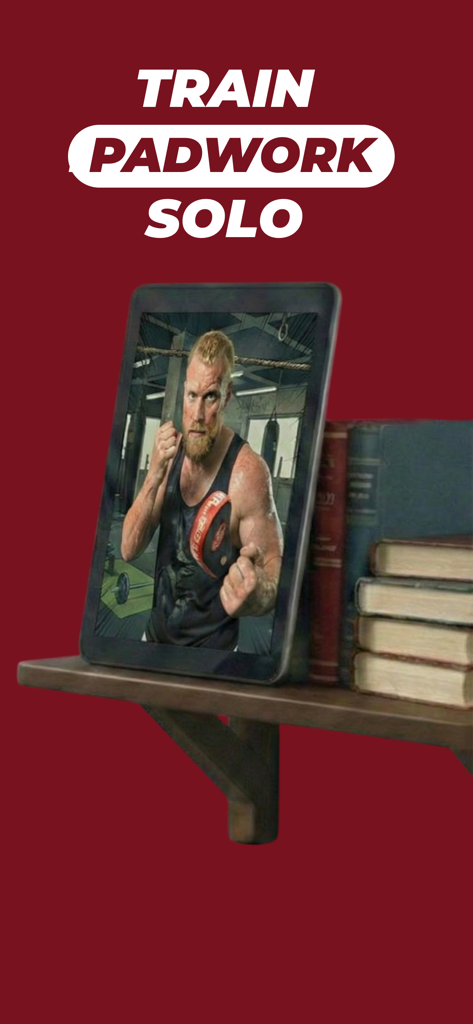 Smartphone displaying a virtual boxing coach for solo padwork drills on a bookshelf.