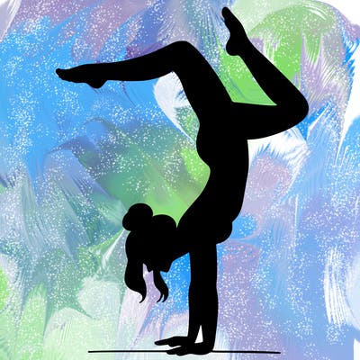 a woman doing a handstand