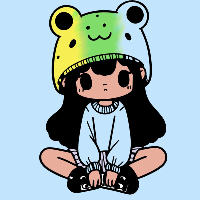 a girl wearing a frog hat and some frog socks