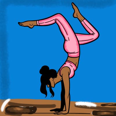 a woman doing a handstand