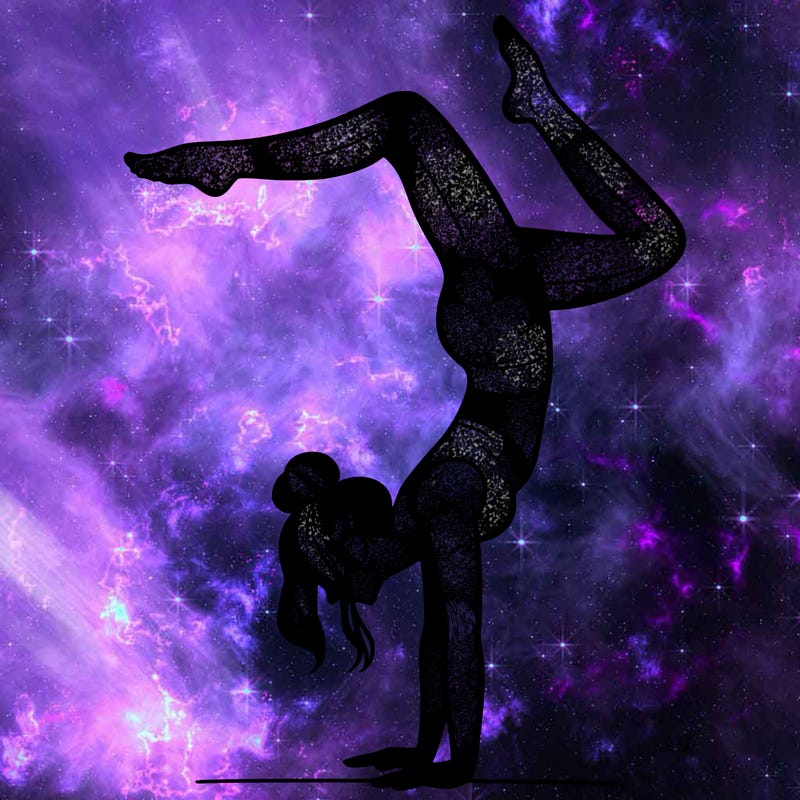 a woman doing a handstand