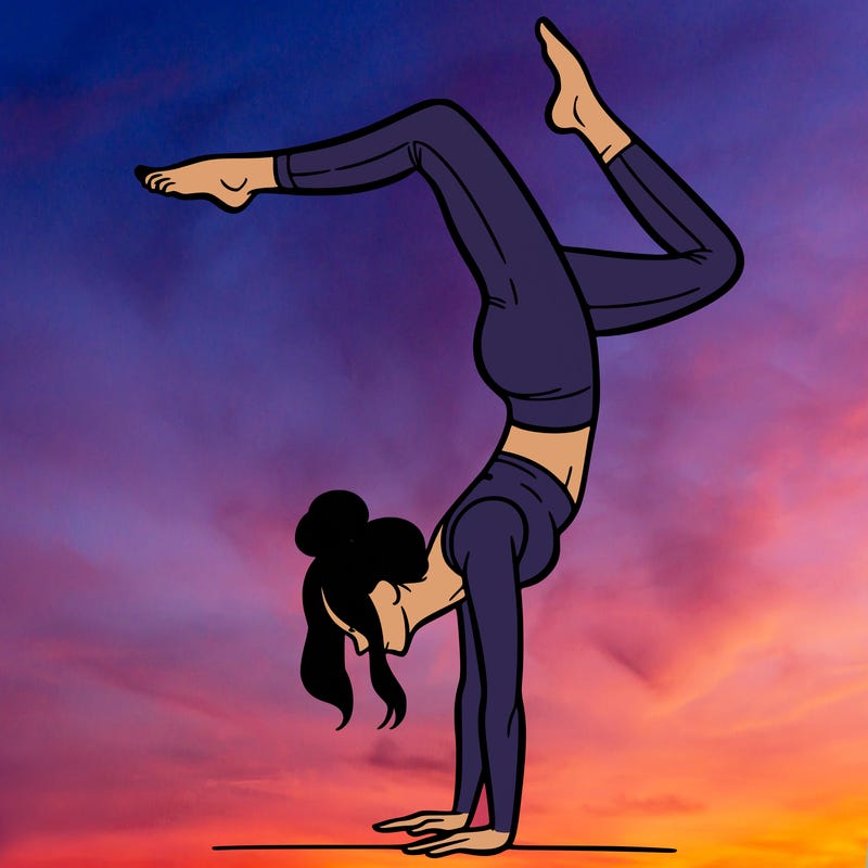 a woman doing a handstand