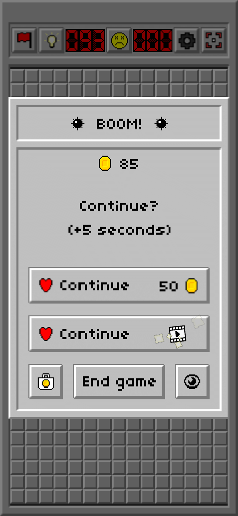 Minesweeper Classic: Retro - Écran de fin de partie dans Démineur Classique Rétro montrant les options pour continuer avec des pièces ou des publicités