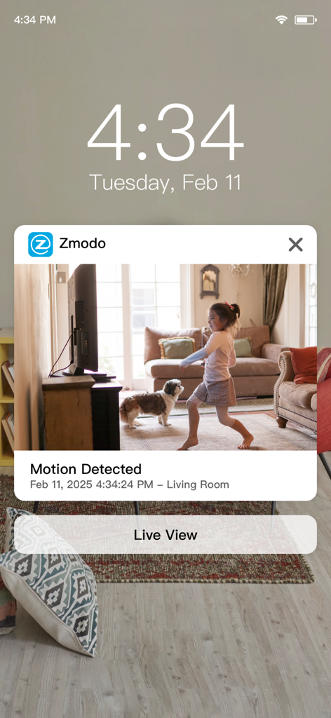 Zmodo - Zmodo mobile app notification showing a motion alert with a camera view of a living room