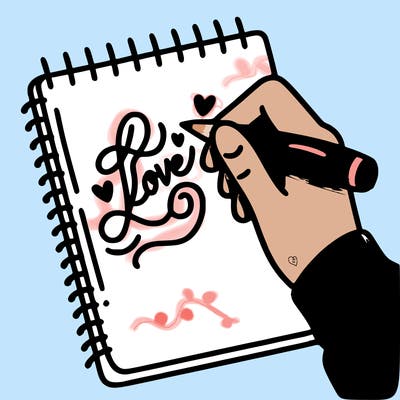 a hand writing “love” in calligraphy on a notebook