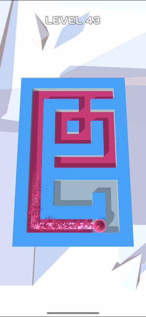 A pink ball rolling through a maze puzzle leaving a trail of paint in Roller Splat