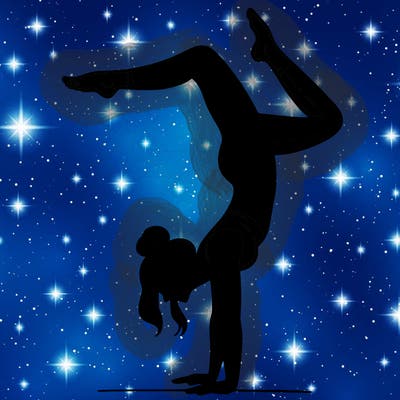 a woman doing a handstand