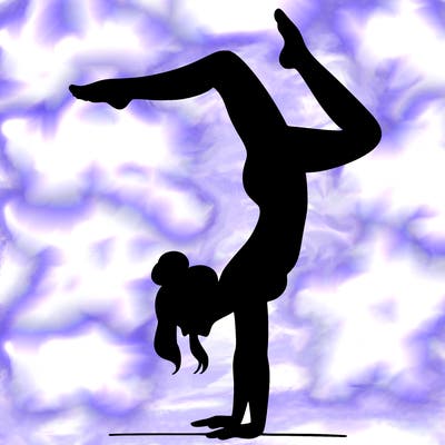 a woman doing a handstand