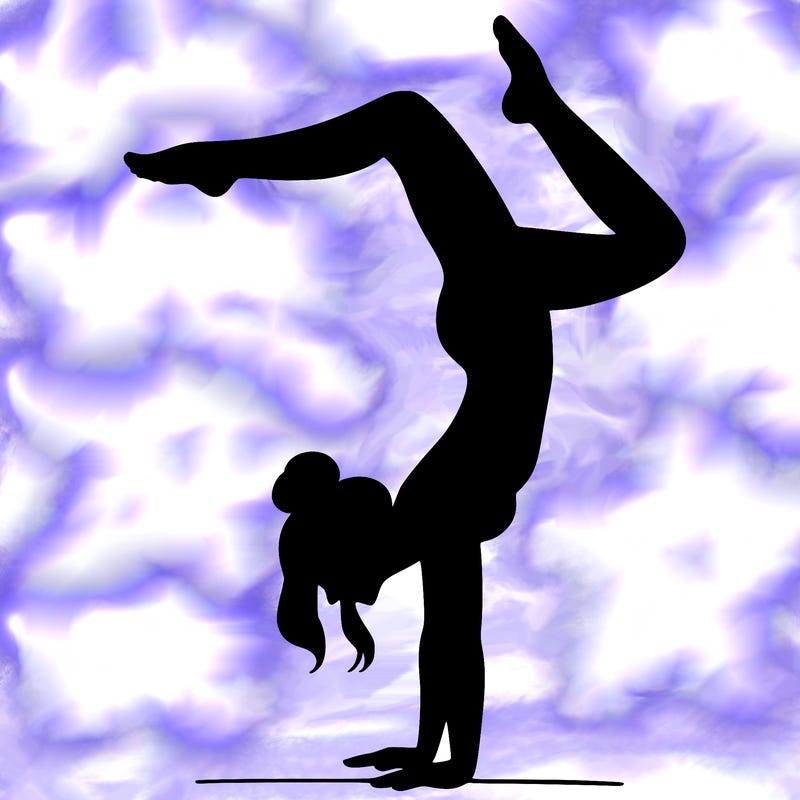 a woman doing a handstand