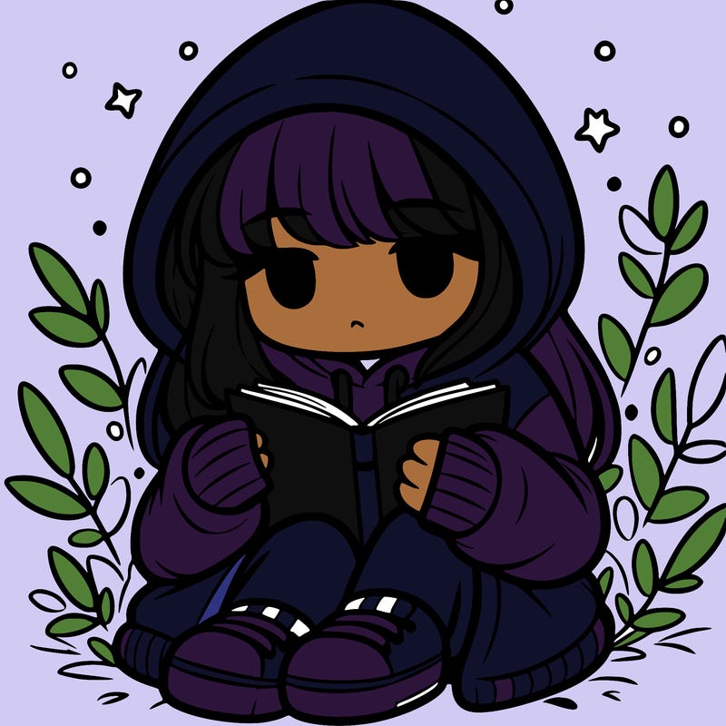 girl in oversized hoodie reading a book