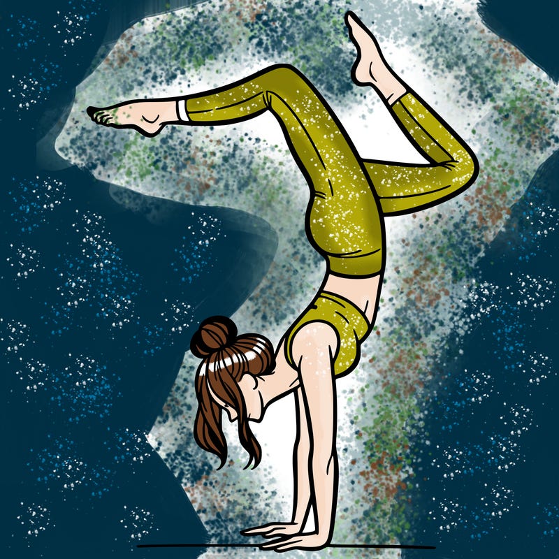 a woman doing a handstand