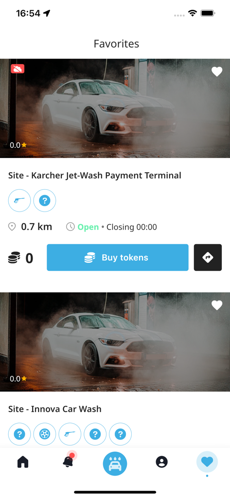 Ready2Wash app interface showing a list of favorite car wash locations with options to buy tokens