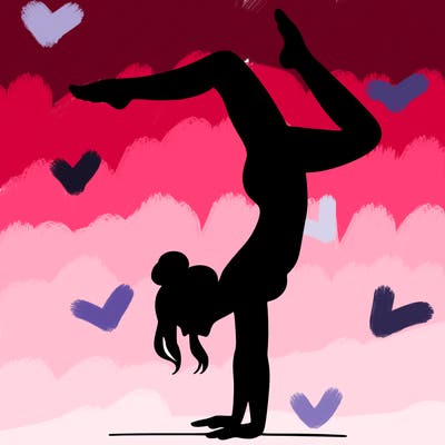 a woman doing a handstand