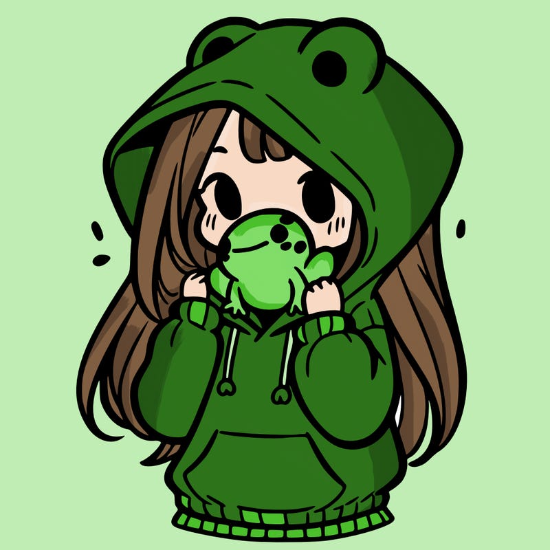 a girl holding a froggy hoodie