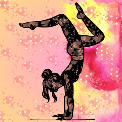 a woman doing a handstand