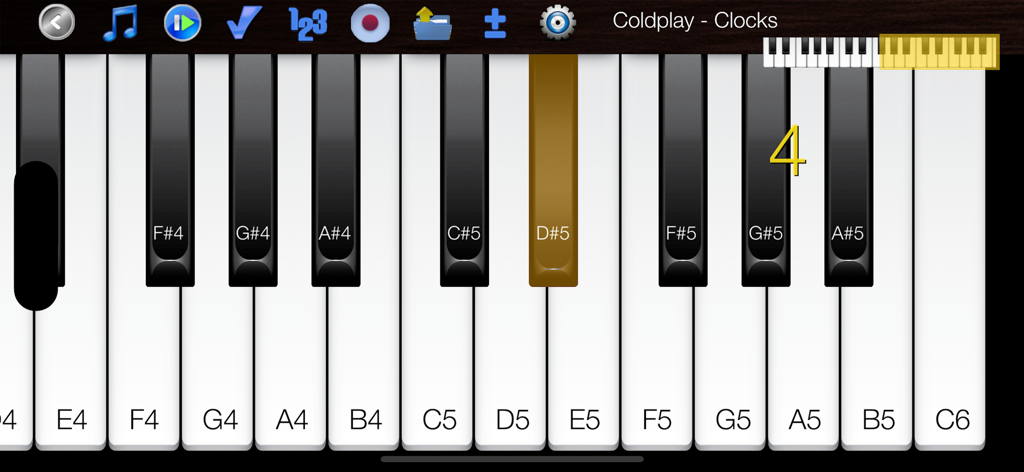 Interface do Piano Melody Pro exibindo teclas rotuladas e uma nota destacada para praticar Clocks do Coldplay