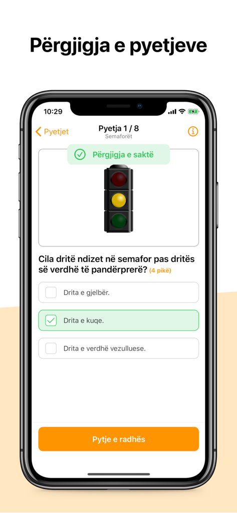Autoshkolla KosovëアプリのiPhoneスクリーンショット。信号機に関する運転学科クイズが表示されています。