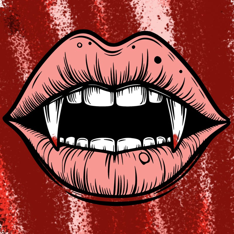 lips with vampire teeth