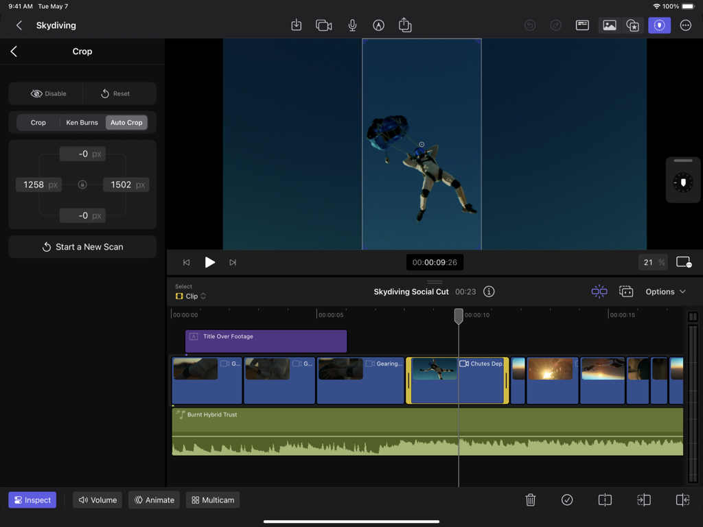A user editing a skydiving video using the Auto Crop AI feature in Final Cut Pro for iPad to create vertical content