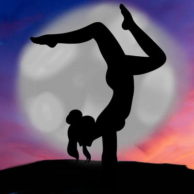 a woman doing a handstand