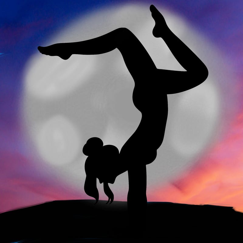 a woman doing a handstand