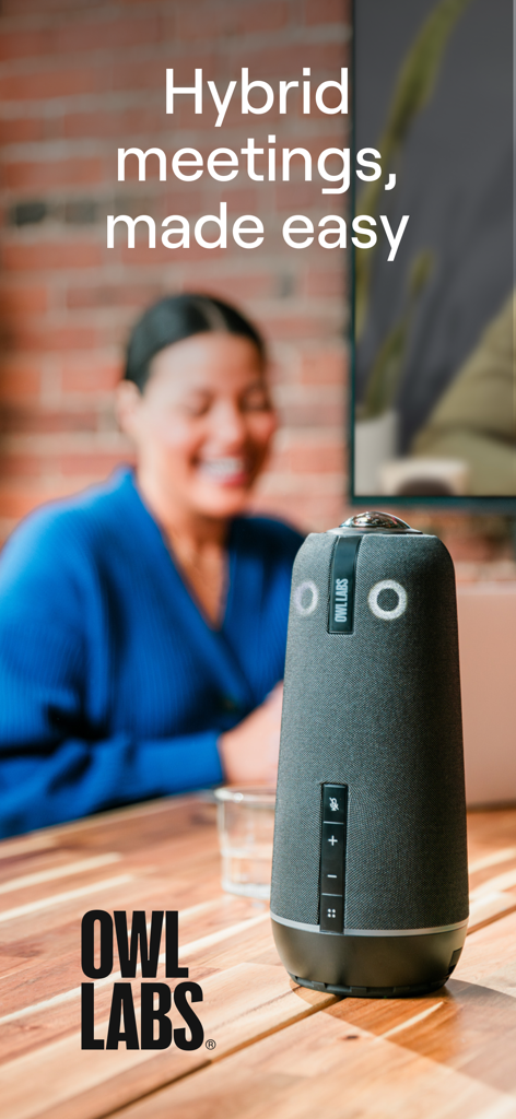 Meeting Owl hardware device on a wooden conference table with the text hybrid meetings made easy
