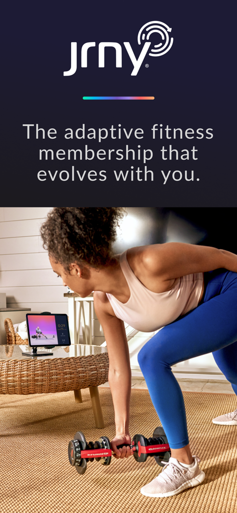 A woman doing a dumbbell row while using the JRNY fitness app on a tablet at home.