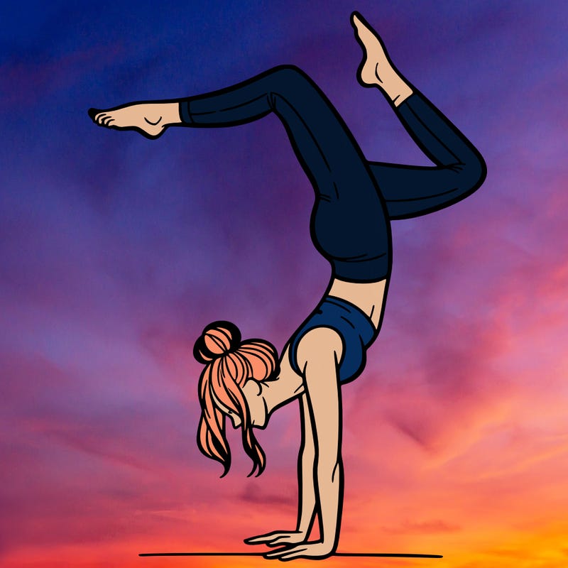 a woman doing a handstand