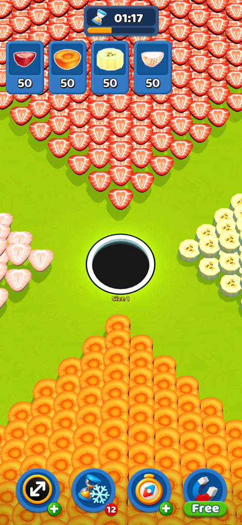 Black Hole - Eat Everything - Interfaccia di gioco mobile di Black Hole Eat Everything con una buca centrale circondata da fette di frutta colorate su uno sfondo verde