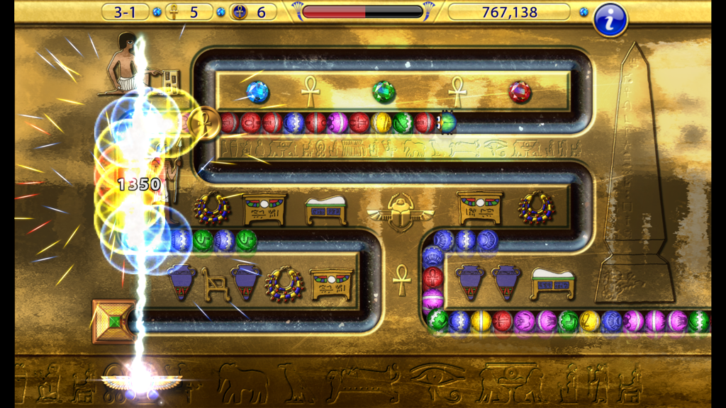 Luxor Amun Rising HD gameplay showing a lightning bolt powerup hitting a chain of colored marbles in an ancient Egyptian themed level.