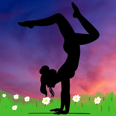 a woman doing a handstand