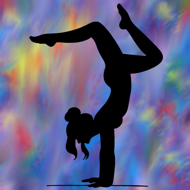 a woman doing a handstand