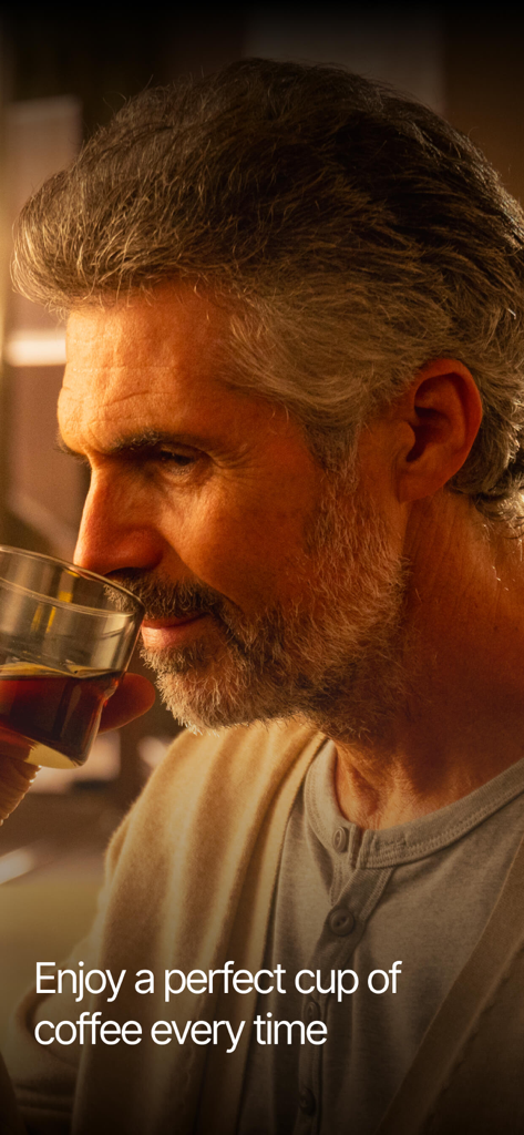 A man smelling and enjoying a perfect cup of coffee brewed with xBloom.