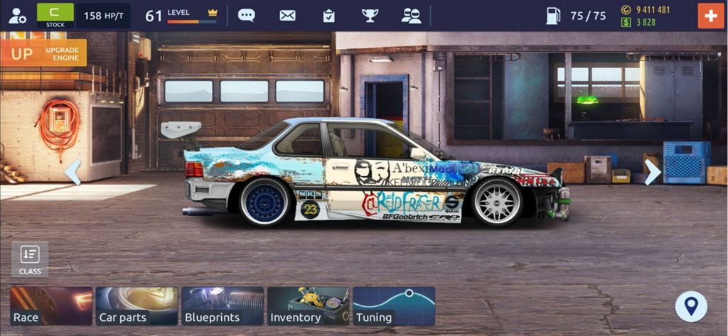 Customized street racing car with unique paint decals and spoilers inside a garage