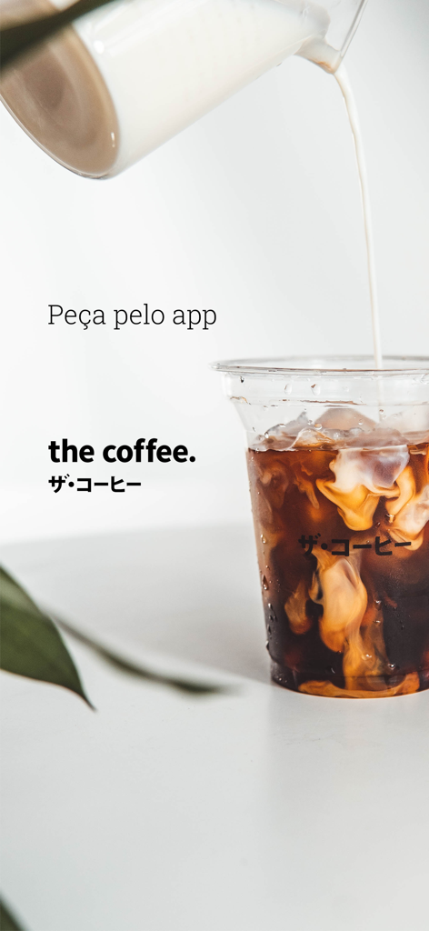 The Coffee - Milk pouring into a cup of iced coffee with The Coffee brand logo