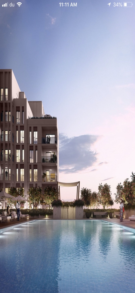 Nshama Connect - Modern luxury apartment building with a swimming pool at sunset