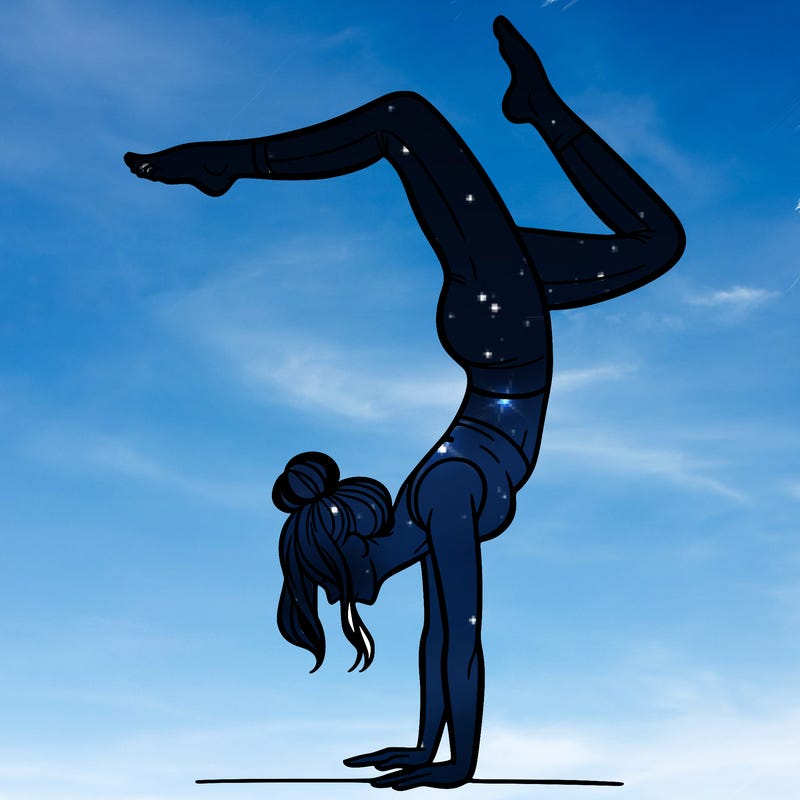 a woman doing a handstand
