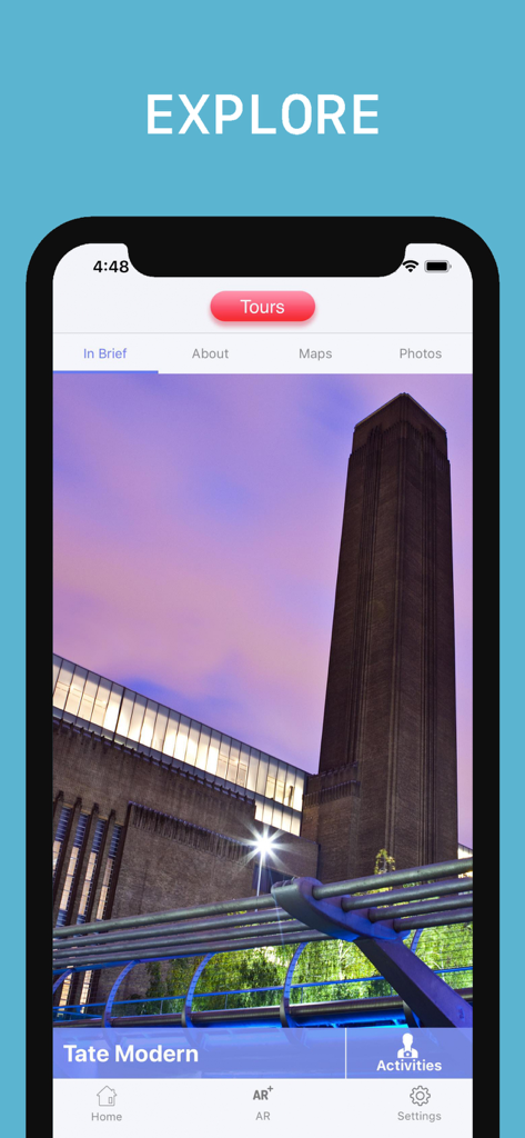 Tate Modern Visitor Guide - Tate Modern Visitor Guide app interface showing the museum building at night on the explore screen