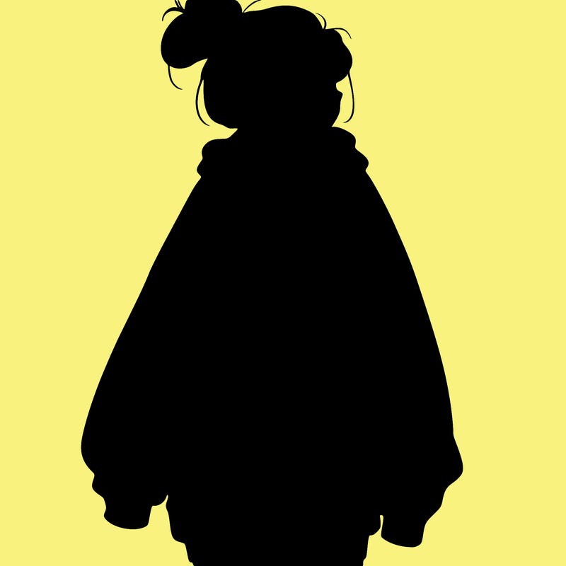 realistic girl with a oversized sweatshirt on and a bun