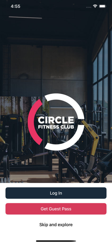 CIRCLE Fitness - CIRCLE Fitness app welcome screen with login and guest pass buttons over a gym background