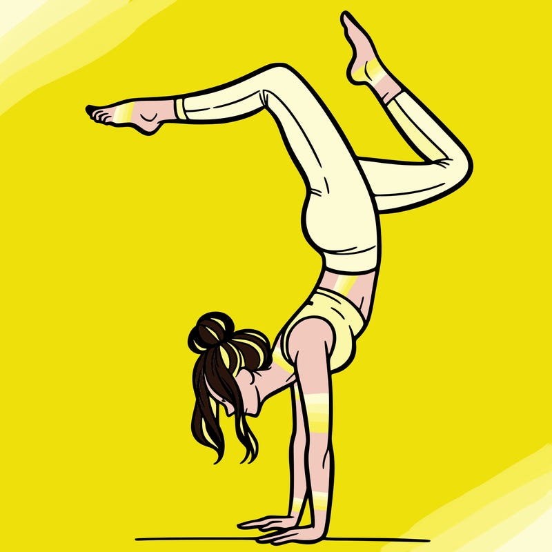 a woman doing a handstand