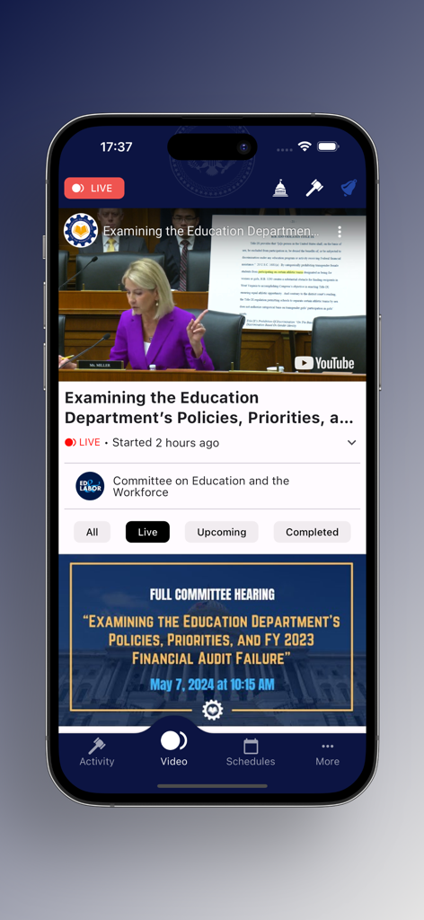 Dome Watch - Écran de smartphone affichant un flux vidéo en direct d'une audition de commission sur l'application Dome Watch