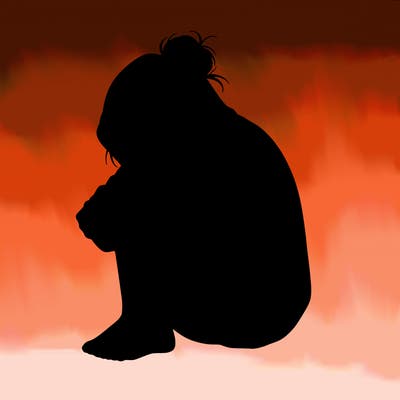 girl crying with hoodie over her hair and hair in bun