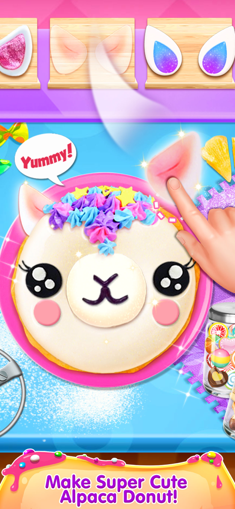 Donut Maker - Cooking Games! - A hand decorating a cute alpaca-shaped donut with colorful frosting and ears in the Donut Maker cooking game.