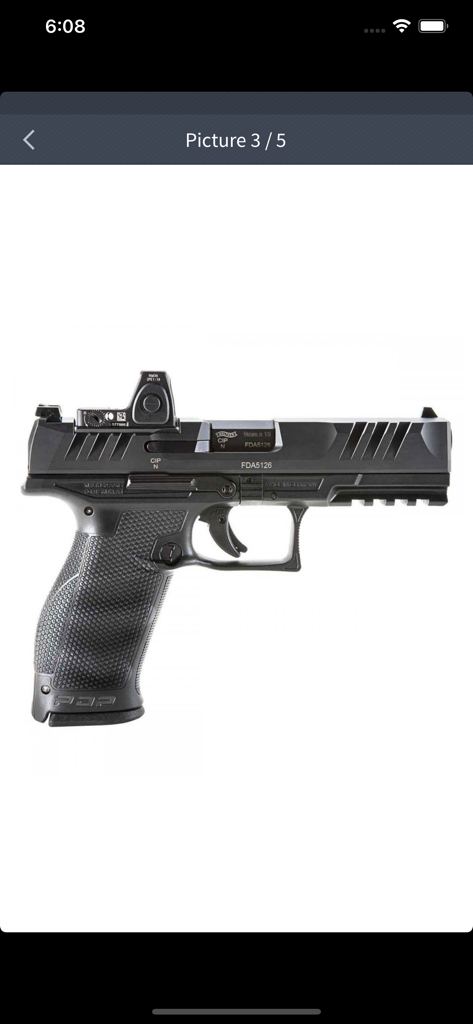 Profile view of a black Walther PDP handgun with a mounted red dot optic