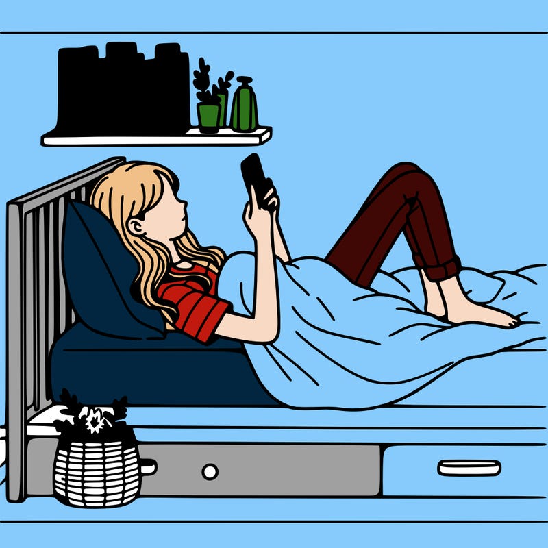 a girl laying on her bed with her phone
