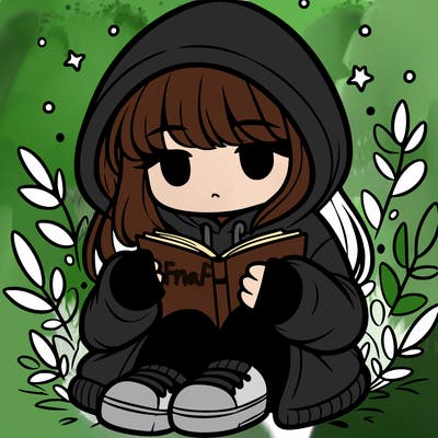 girl in oversized hoodie reading a book